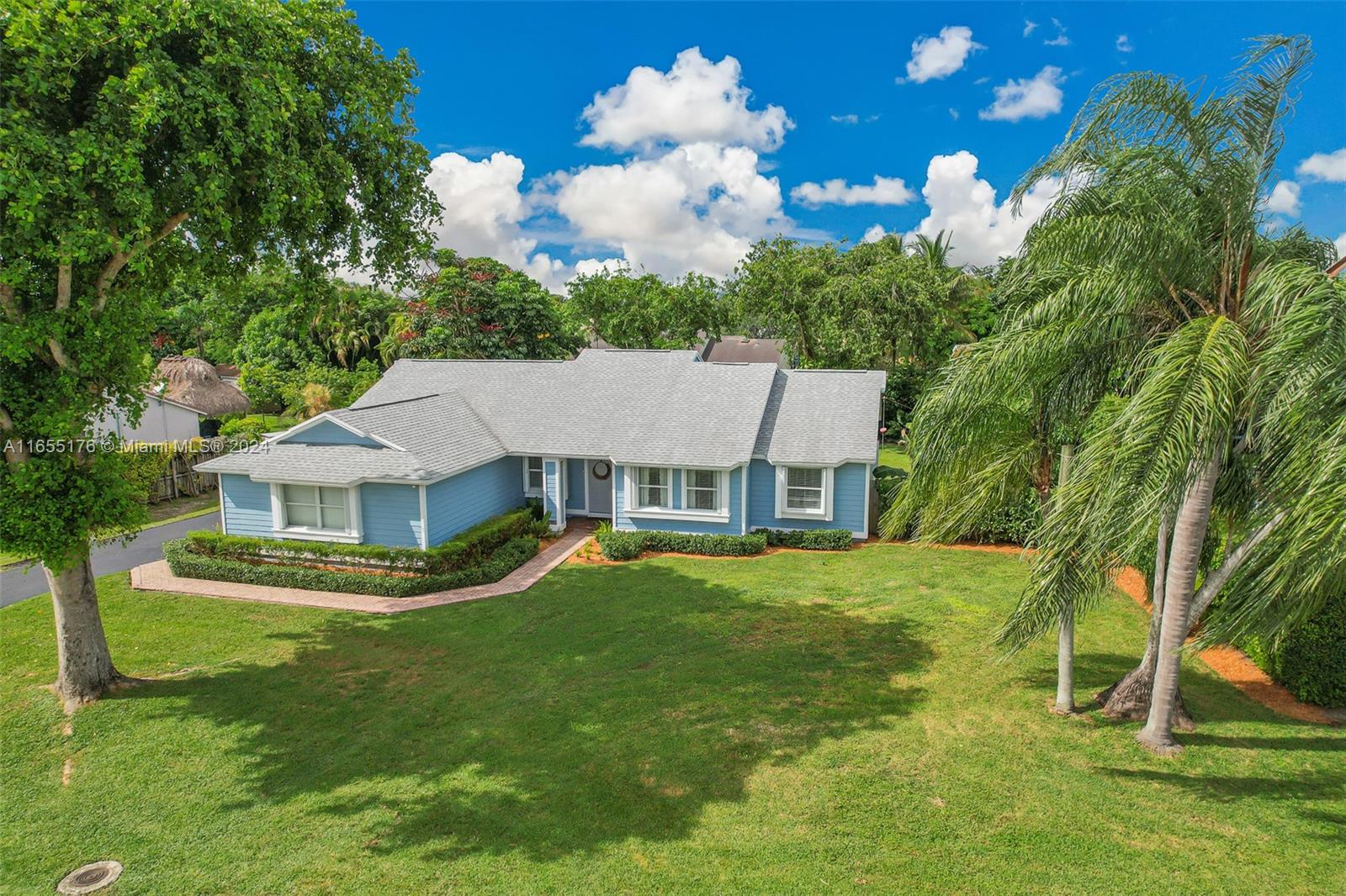 14871 Southwest 156th Street Miami, FL 33187 - Photo 6 of 84 a view of a house with a yard