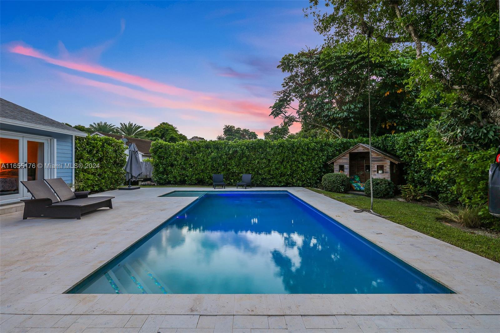 14871 Southwest 156th Street Miami, FL 33187 - Photo 61 of 84 a view of a swimming pool with a yard