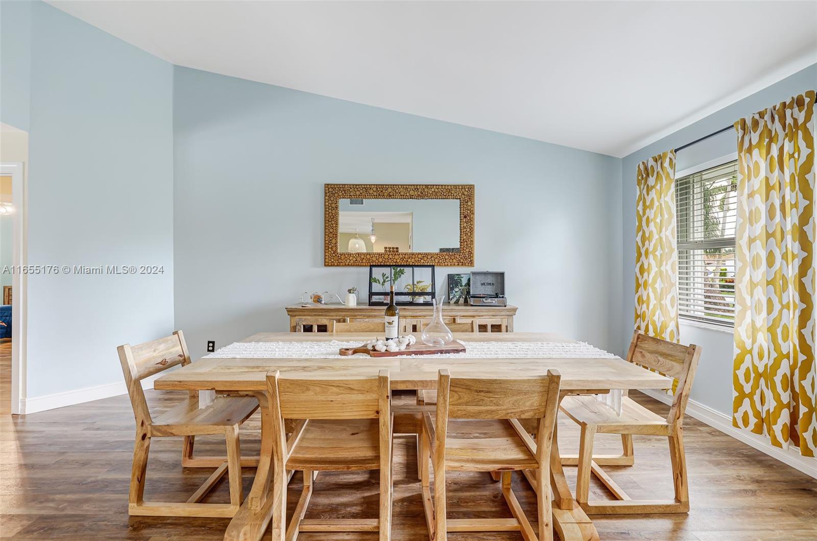 14871 Southwest 156th Street Miami, FL 33187 - Photo 9 of 84 a view of a dining room with furniture window and wooden floor