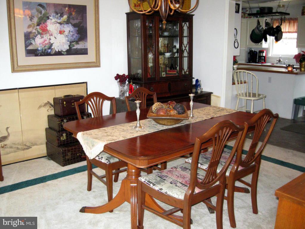 159 1/2 Wesley Road Quarryville, PA 17566 - Photo 11 of 43 a view of a dining room with furniture and chandelier
