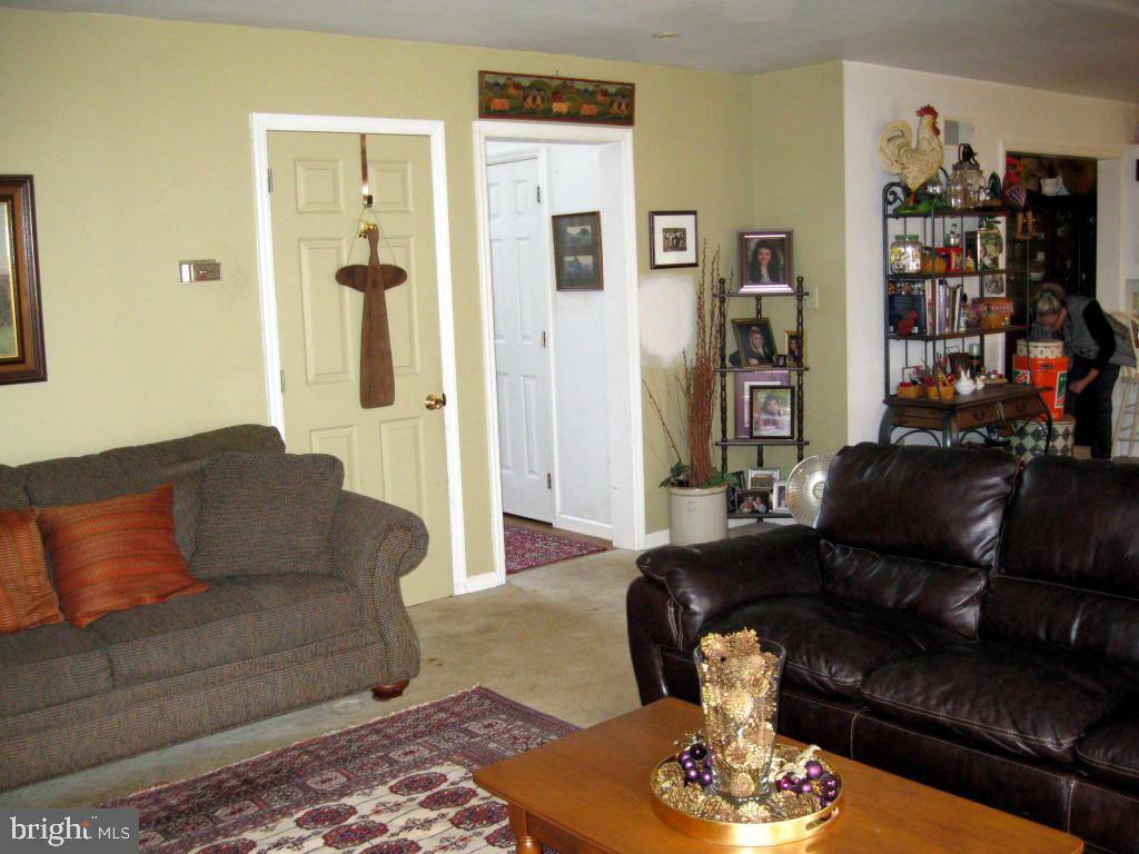 159 1/2 Wesley Road Quarryville, PA 17566 - Photo 23 of 43 a living room with furniture and a wooden floor