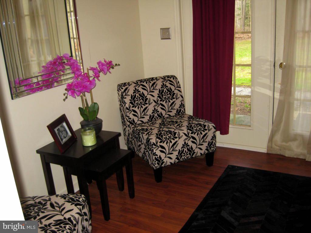 159 1/2 Wesley Road Quarryville, PA 17566 - Photo 26 of 43 a bed room with a chair and a potted plant