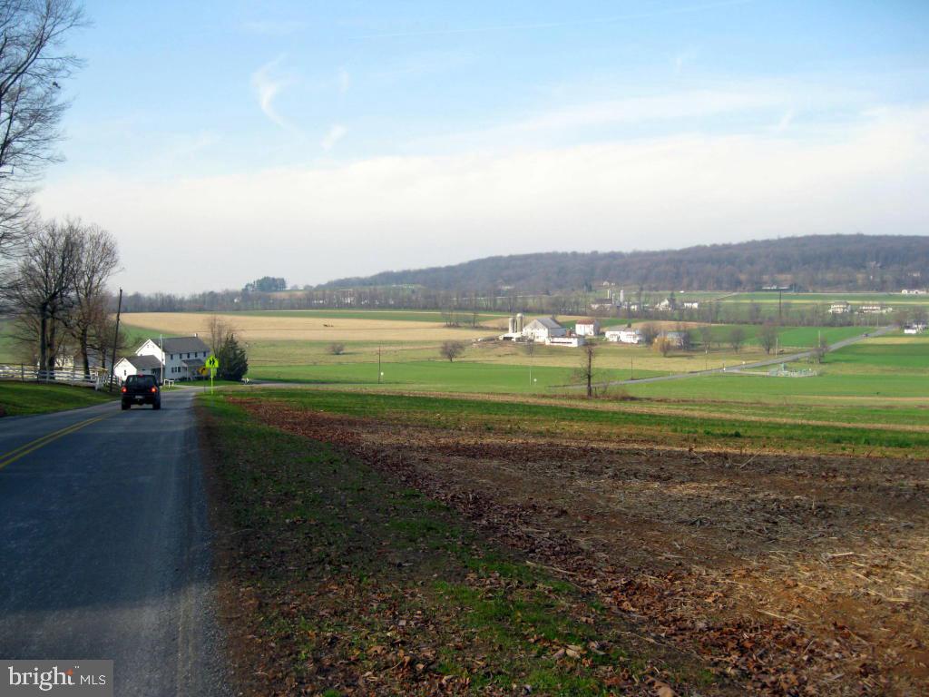 159 1/2 Wesley Road Quarryville, PA 17566 - Photo 43 of 43 a view of a golf course with a lake
