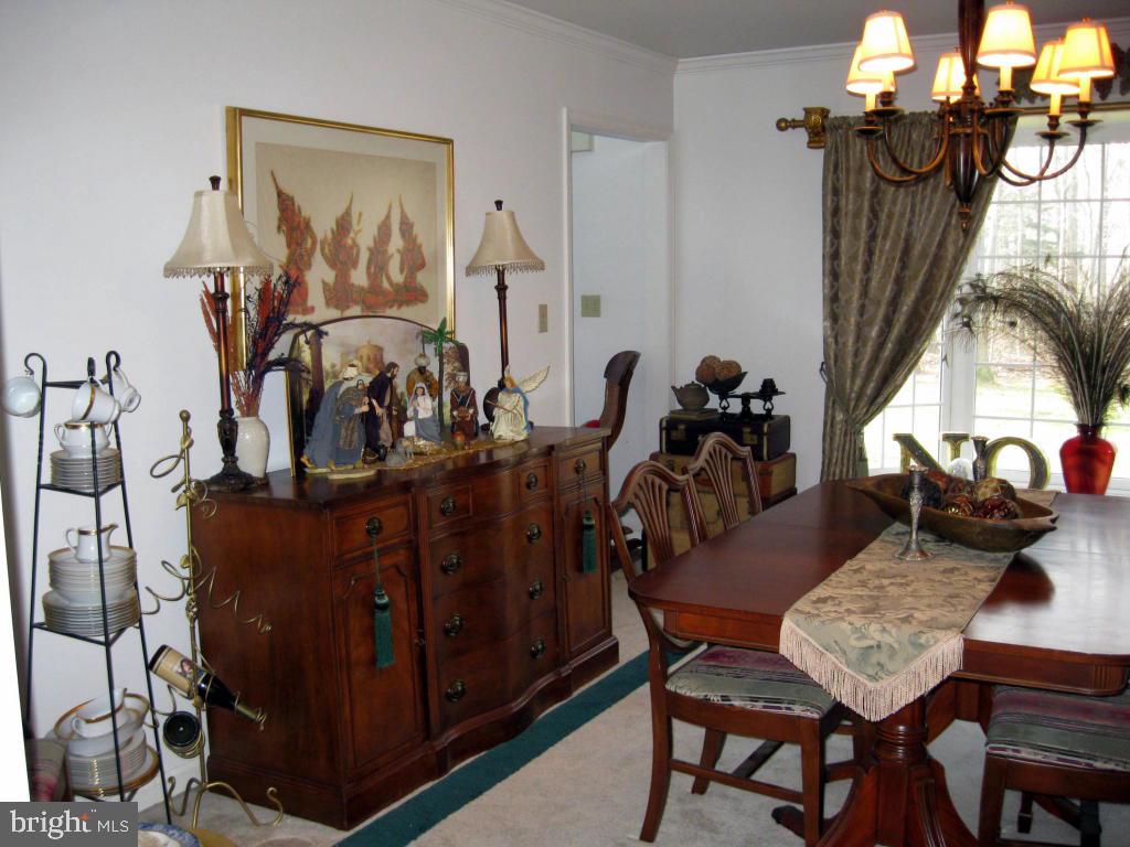 159 1/2 Wesley Road Quarryville, PA 17566 - Photo 9 of 43 a view of a dining room with furniture and wooden floor