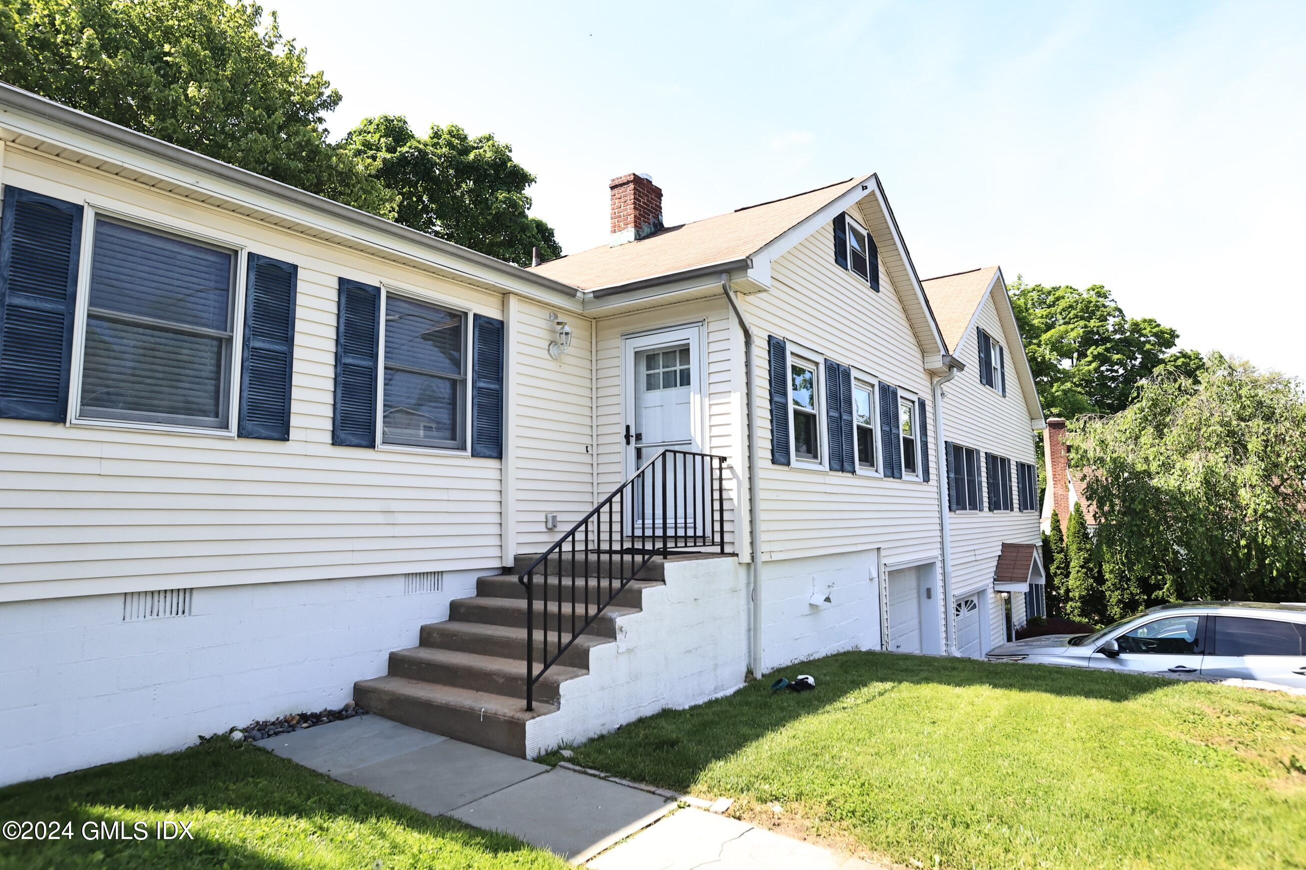 4 Silver Street, Unit B Greenwich, CT 06830 - Photo 2 of 24 a view of a house with swimming pool and a porch with furniture