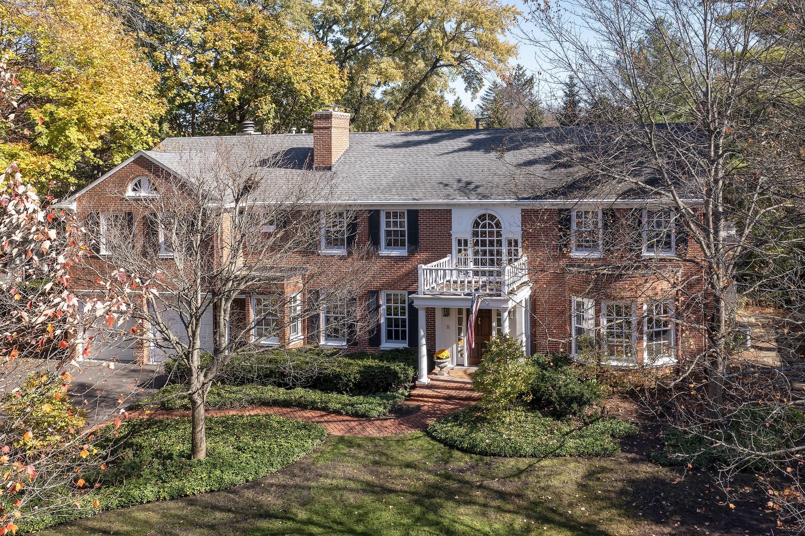 141 Apple Tree Road Winnetka, IL 60093 - Photo 51 of 51 a front view of a house with garden