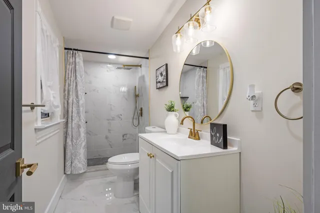 a view of a hallway with paintings on the wall