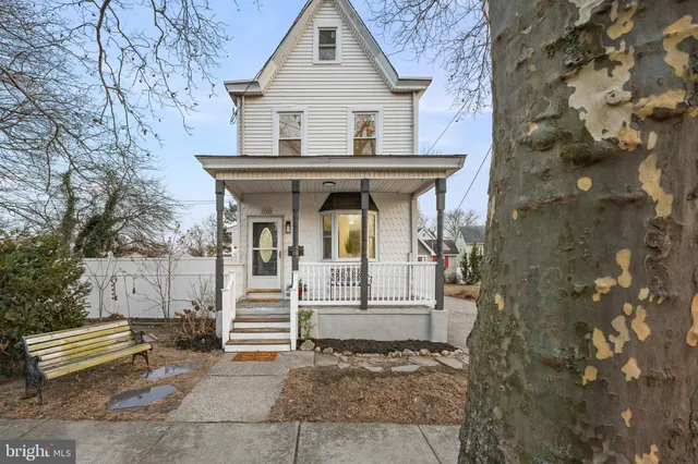 a front view of a house with outdoor seating
