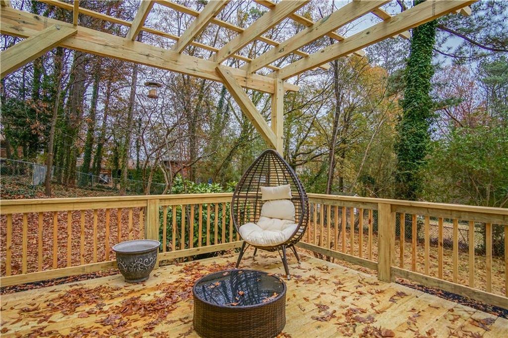 2640 Casher Drive Decatur, GA 30034 - Photo 11 of 40 a roof deck with table and chairs and potted plants