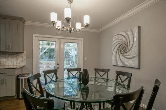 a view of a dining room with furniture and window