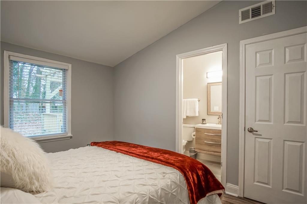 2640 Casher Drive Decatur, GA 30034 - Photo 32 of 40 a bedroom with a bed and a window