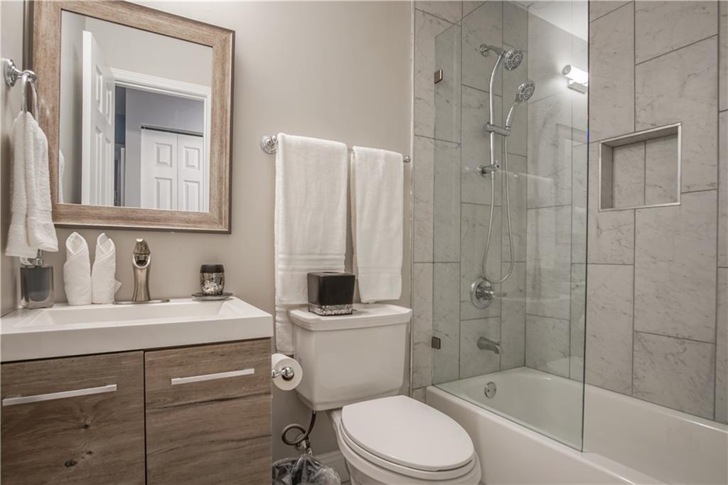 2640 Casher Drive Decatur, GA 30034 - Photo 34 of 40 a bathroom with a sink a toilet and shower