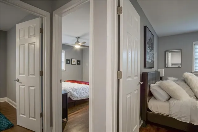 a view of bedroom with wooden floor
