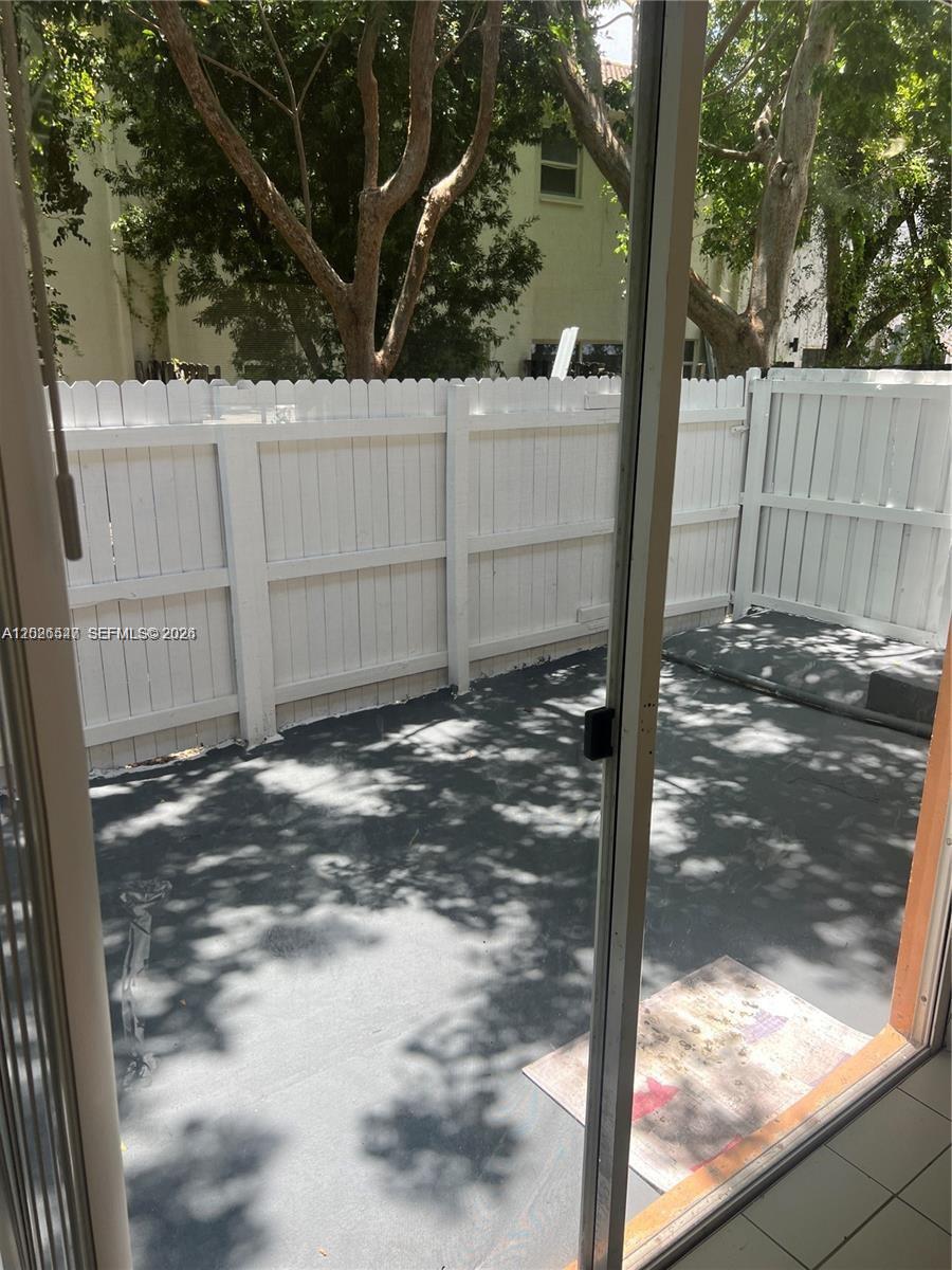 2910 Southeast 15th Road, Unit 55 Homestead, FL 33035 - Photo 8 of 13 a view of a backyard of a house