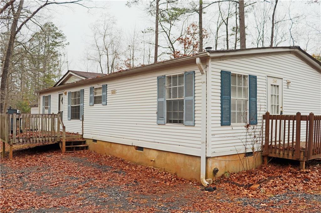 a view of a house with wooden fence