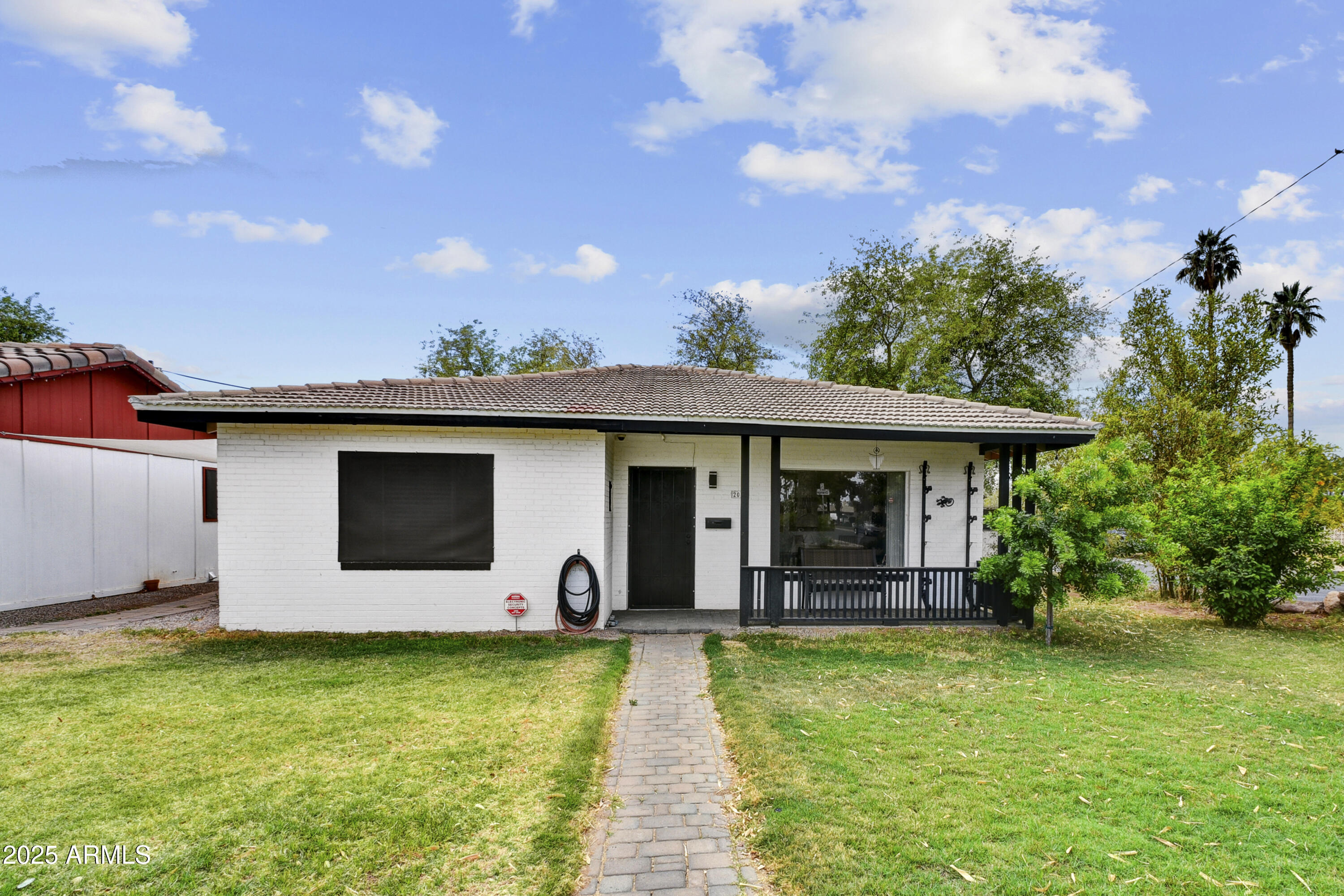 2045 West Orange Drive Phoenix, AZ 85015 - Photo 1 of 20 a front view of a house with garden