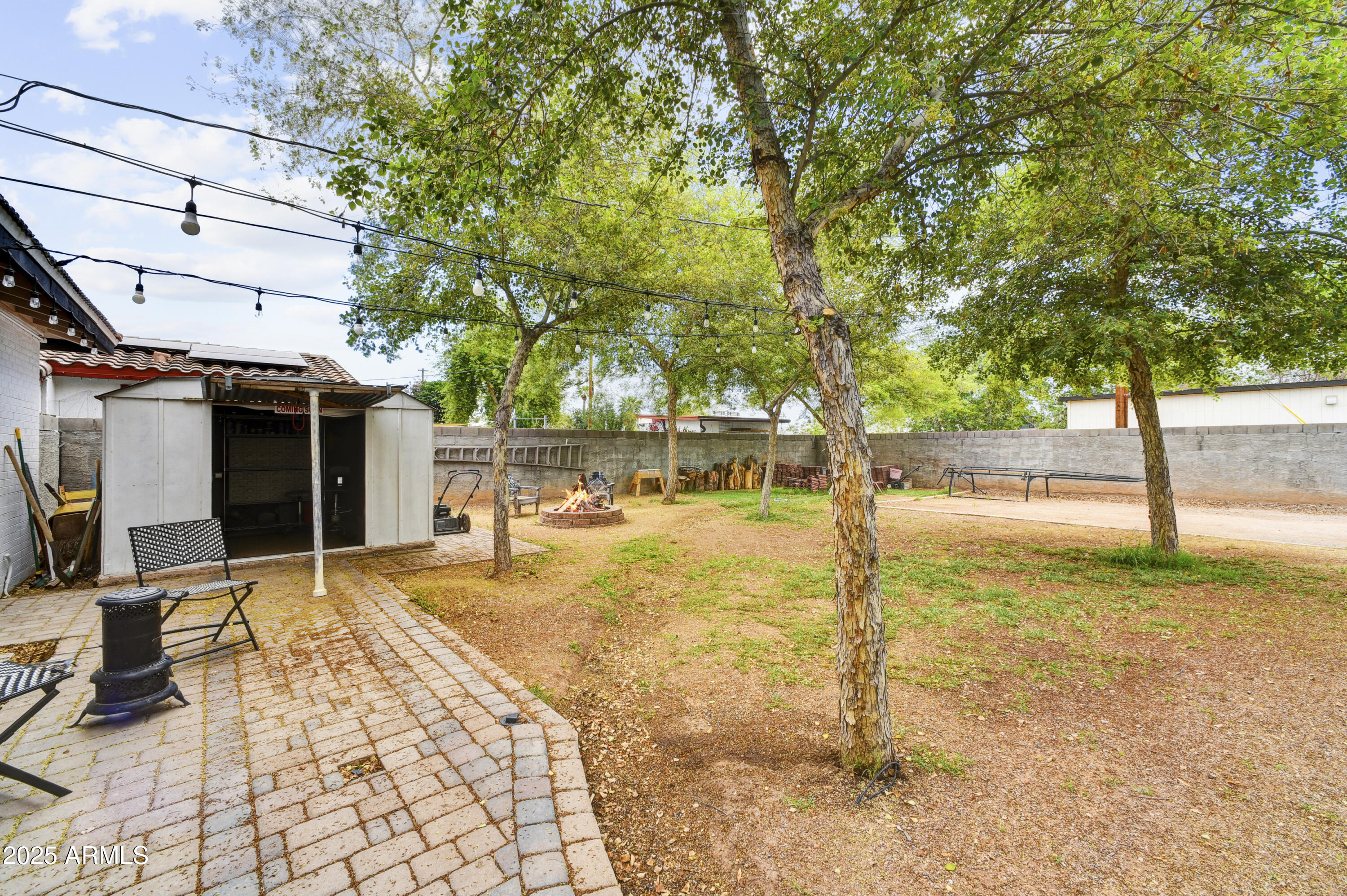 2045 West Orange Drive Phoenix, AZ 85015 - Photo 12 of 20 a view of a house with backyard and trees