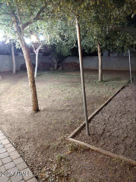 2045 West Orange Drive Phoenix, AZ 85015 - Photo 19 of 20 a view of a house with a yard