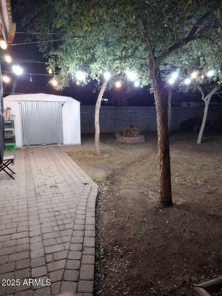 2045 West Orange Drive Phoenix, AZ 85015 - Photo 20 of 20 a view of a yard with a tree