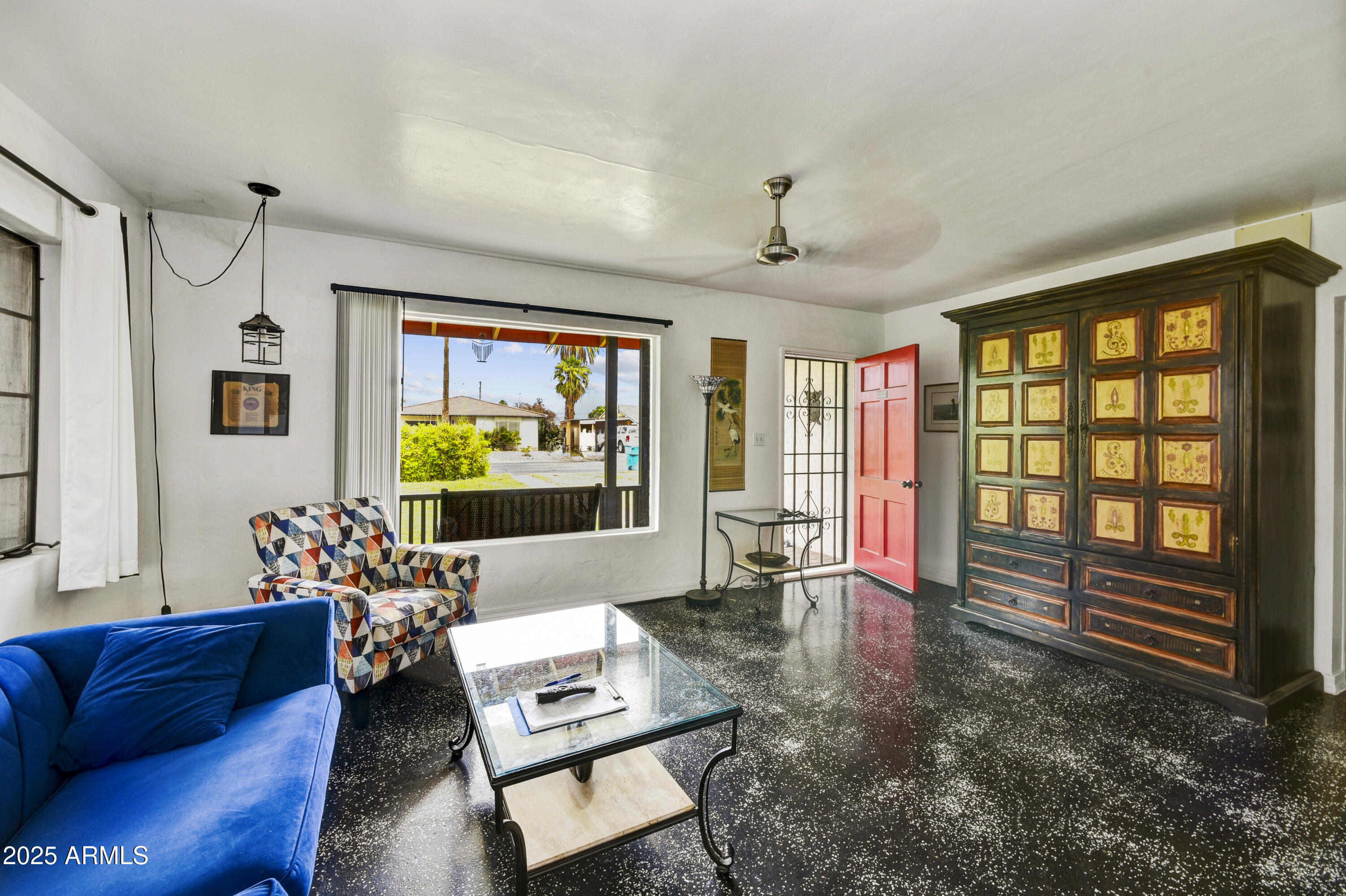 2045 West Orange Drive Phoenix, AZ 85015 - Photo 4 of 20 a living room with furniture and a flat screen tv
