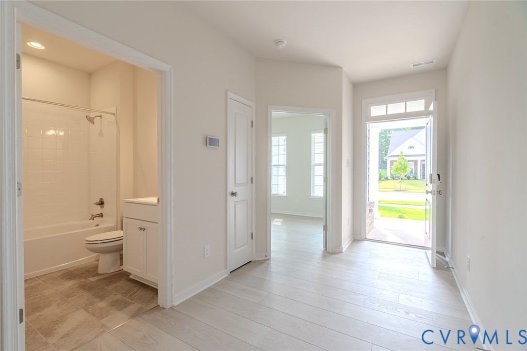 0 Canoe Pointe Loop, Unit 992 Moseley, VA 23120 - Photo 6 of 20 a bathroom with a toilet and a shower
