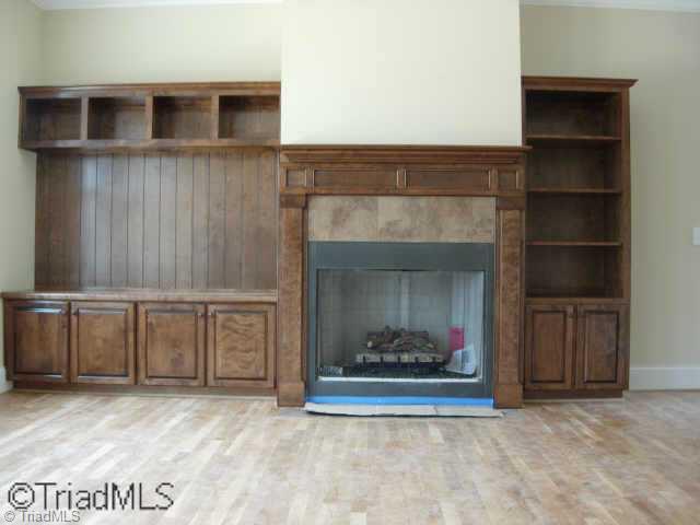 505 Starfire Court Oak Ridge, NC 27310 - Photo 3 of 4 Other. Custom built ins around fireplace as well as a drop zone cubby area in mudroom.