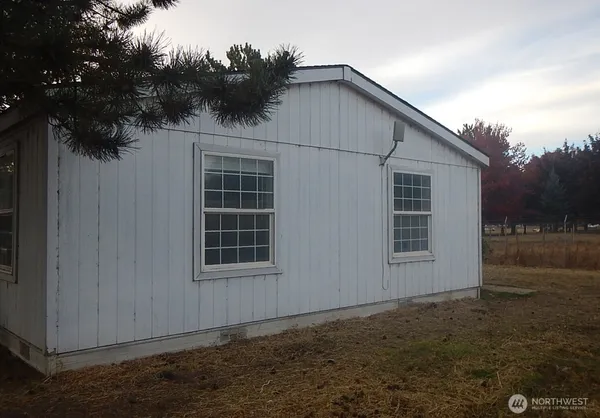 a house with trees in front of it