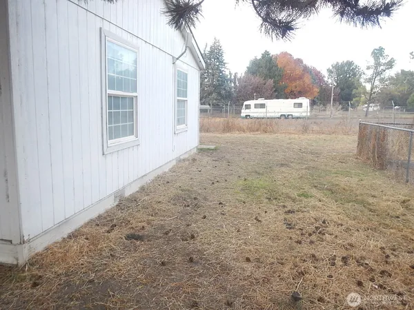 a view of a yard and a garage