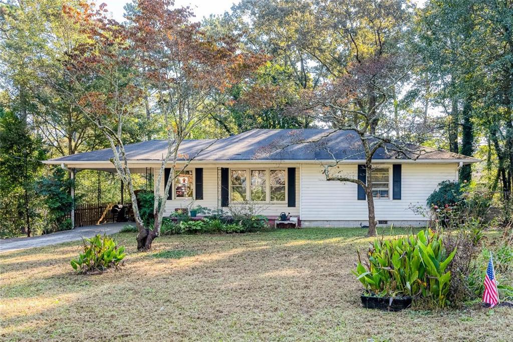 2235 Favor Road Southwest Marietta, GA 30060 - Photo 1 of 1 a front view of a house with garden