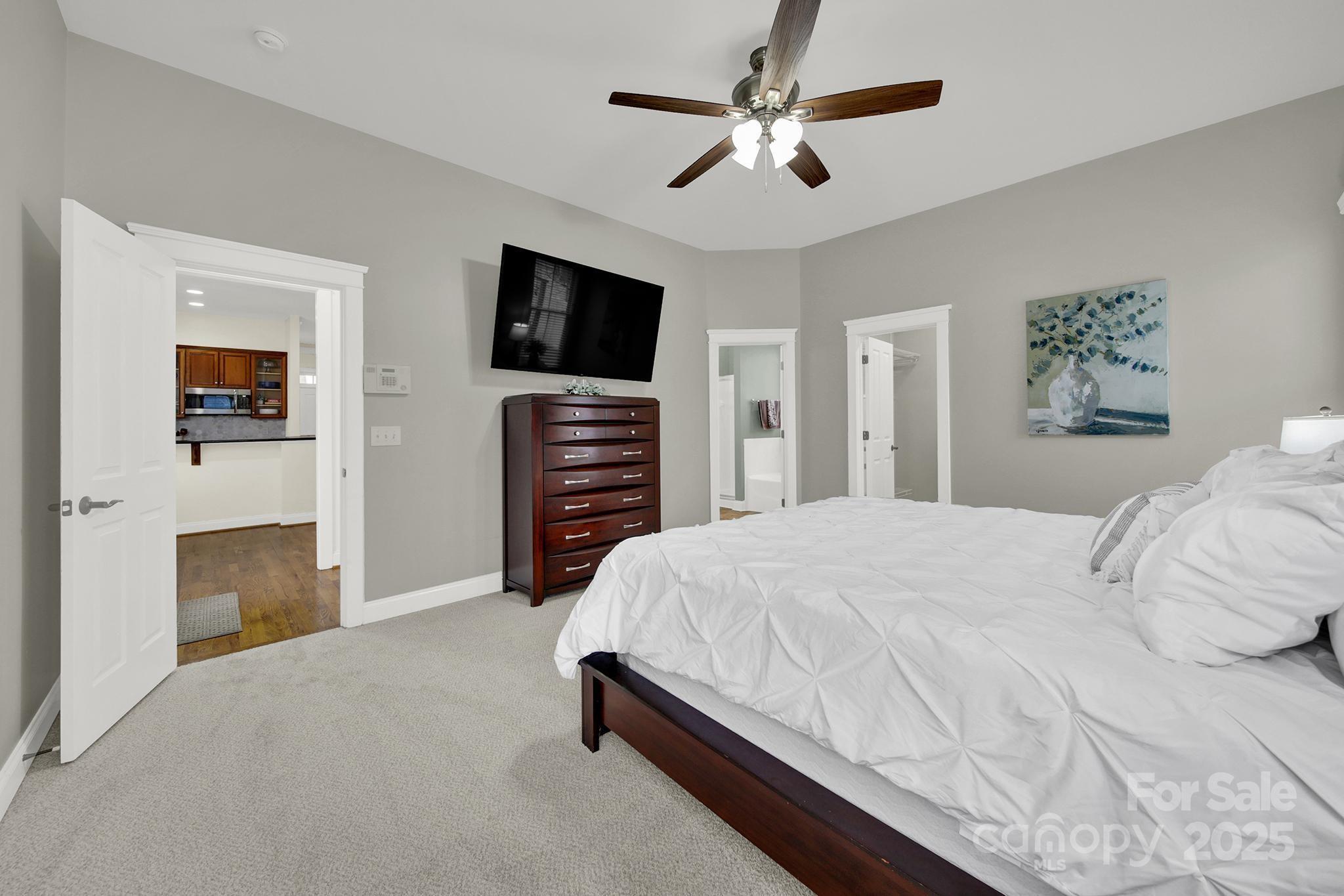 431 Third Baxter Street Fort Mill, SC 29708 - Photo 16 of 39 a bedroom with a bed and a flat screen tv