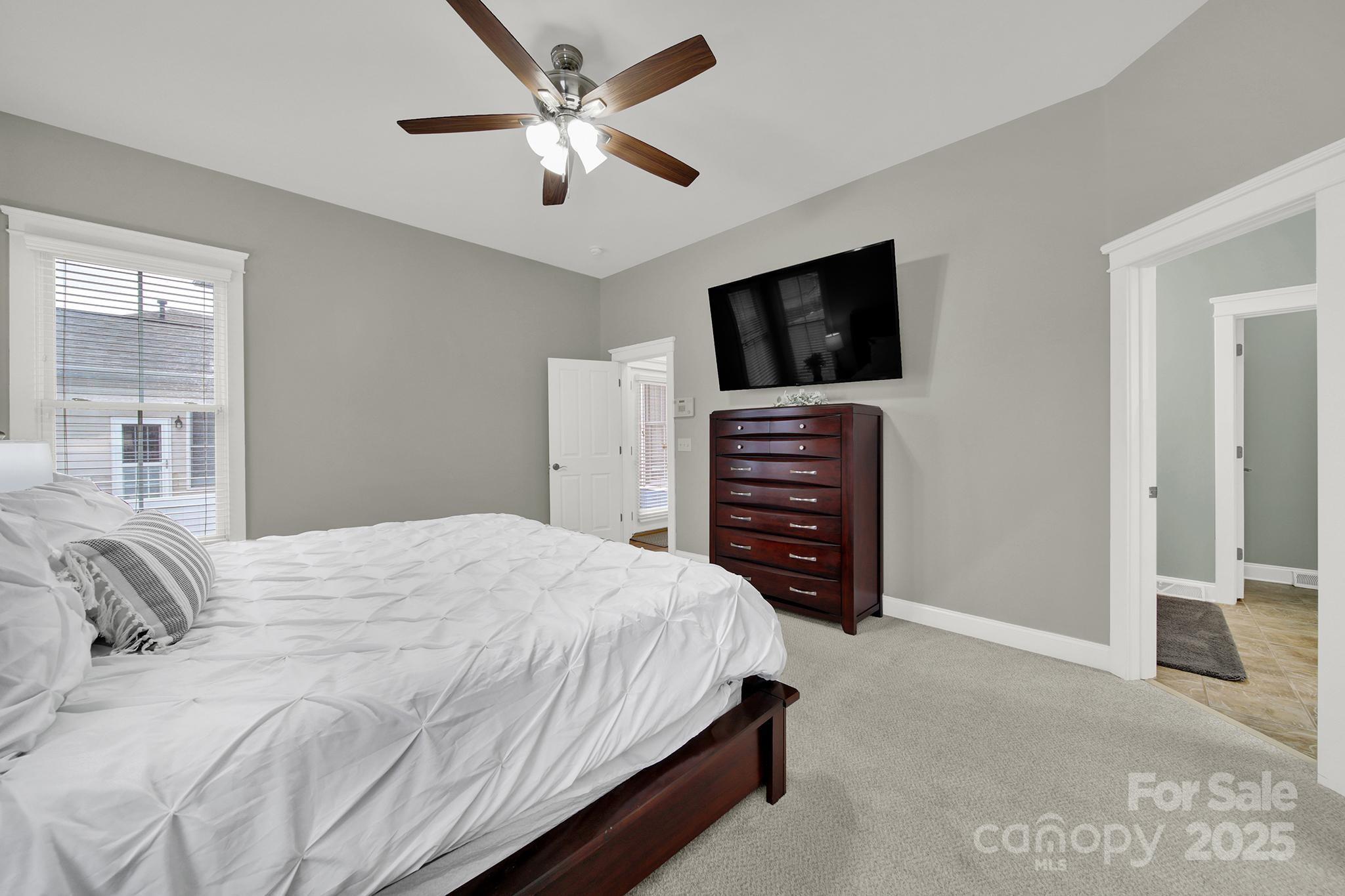 431 Third Baxter Street Fort Mill, SC 29708 - Photo 17 of 39 a bedroom with a bed and a television