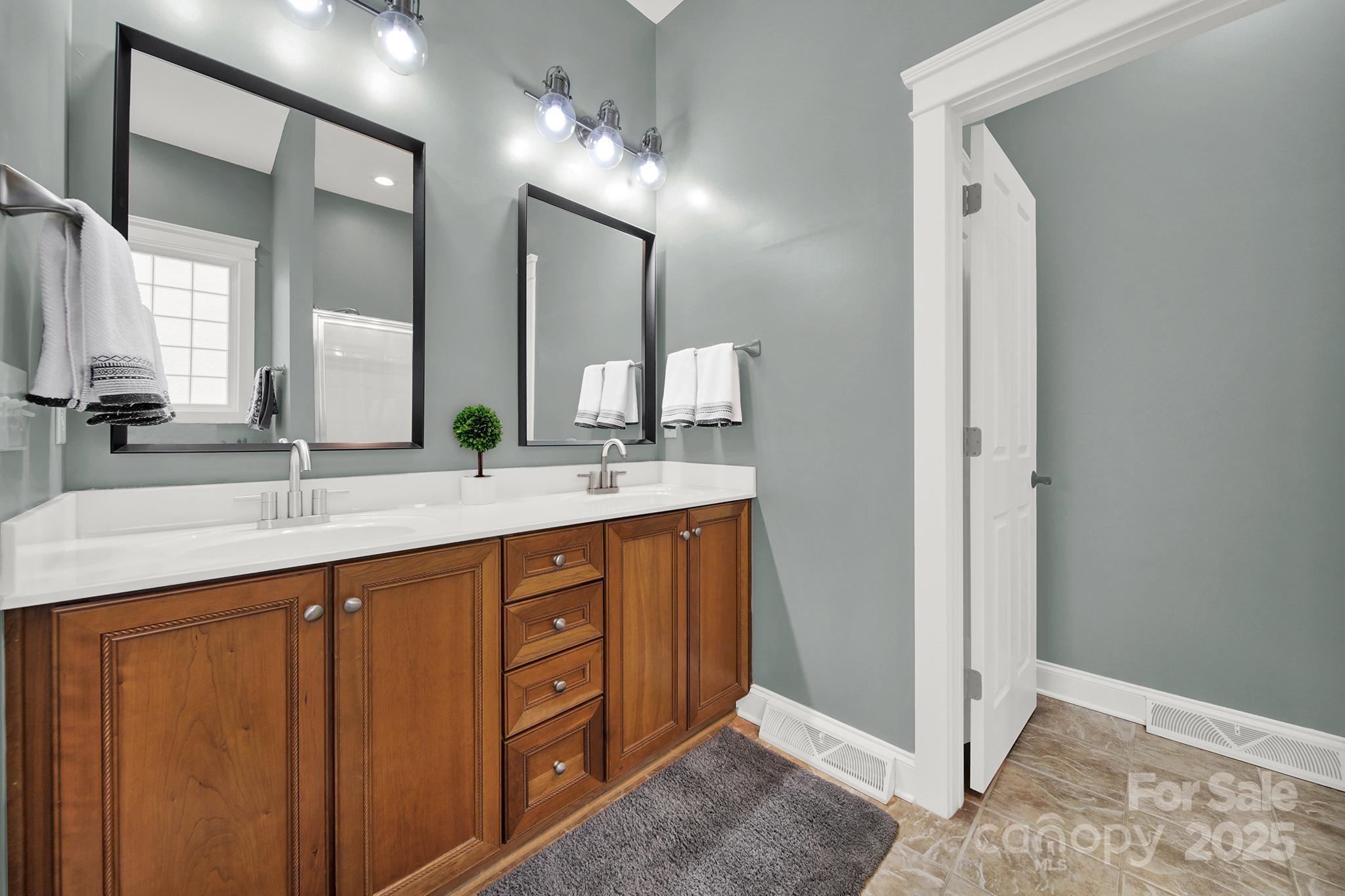 431 Third Baxter Street Fort Mill, SC 29708 - Photo 18 of 39 a bathroom with a double vanity sink and a mirror