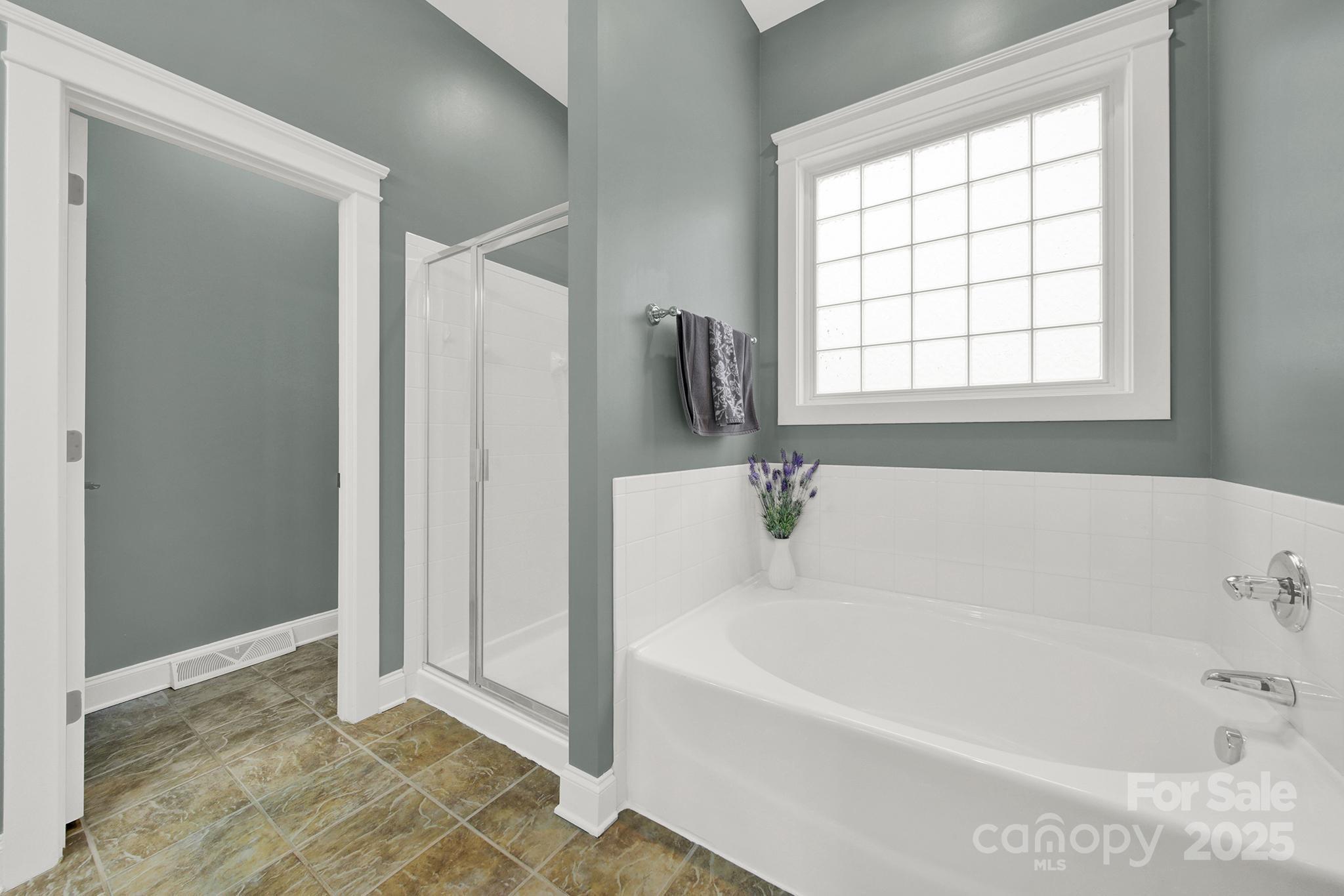 431 Third Baxter Street Fort Mill, SC 29708 - Photo 19 of 39 a white bath tub sitting next to a window