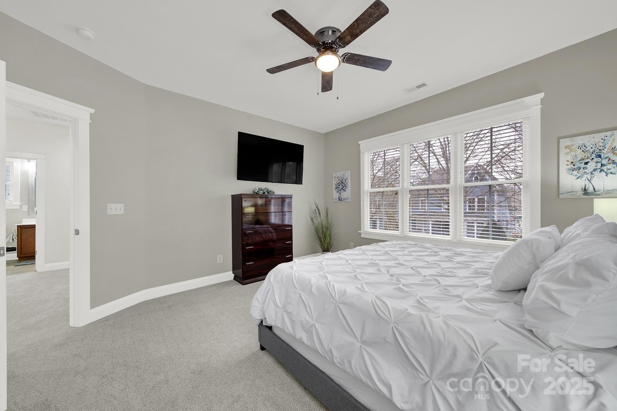 431 Third Baxter Street Fort Mill, SC 29708 - Photo 27 of 39 a bedroom with a large bed and a flat screen tv