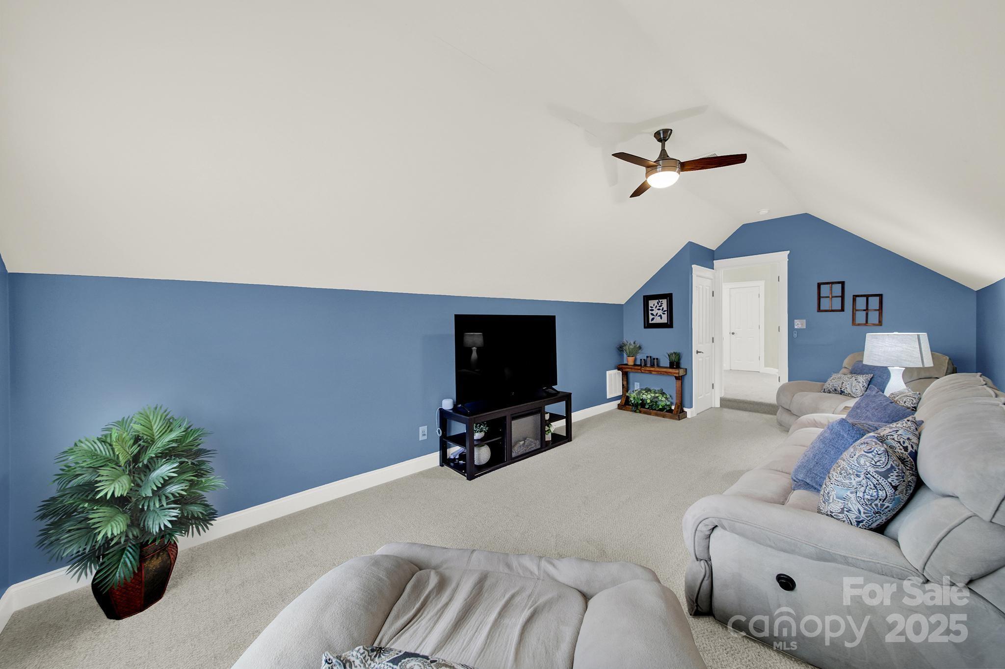 431 Third Baxter Street Fort Mill, SC 29708 - Photo 29 of 39 a living room with furniture and a flat screen tv