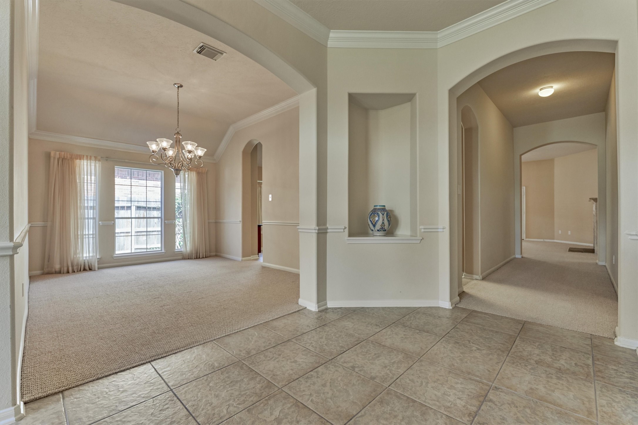 24910 Corbin Gate Drive Spring, TX 77389 - Photo 12 of 49 a view of a hallway with chandelier and entryway