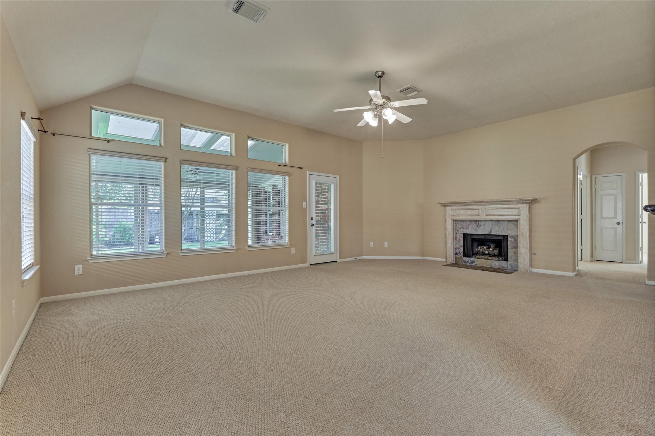 24910 Corbin Gate Drive Spring, TX 77389 - Photo 20 of 49 a view of an empty room with a fireplace