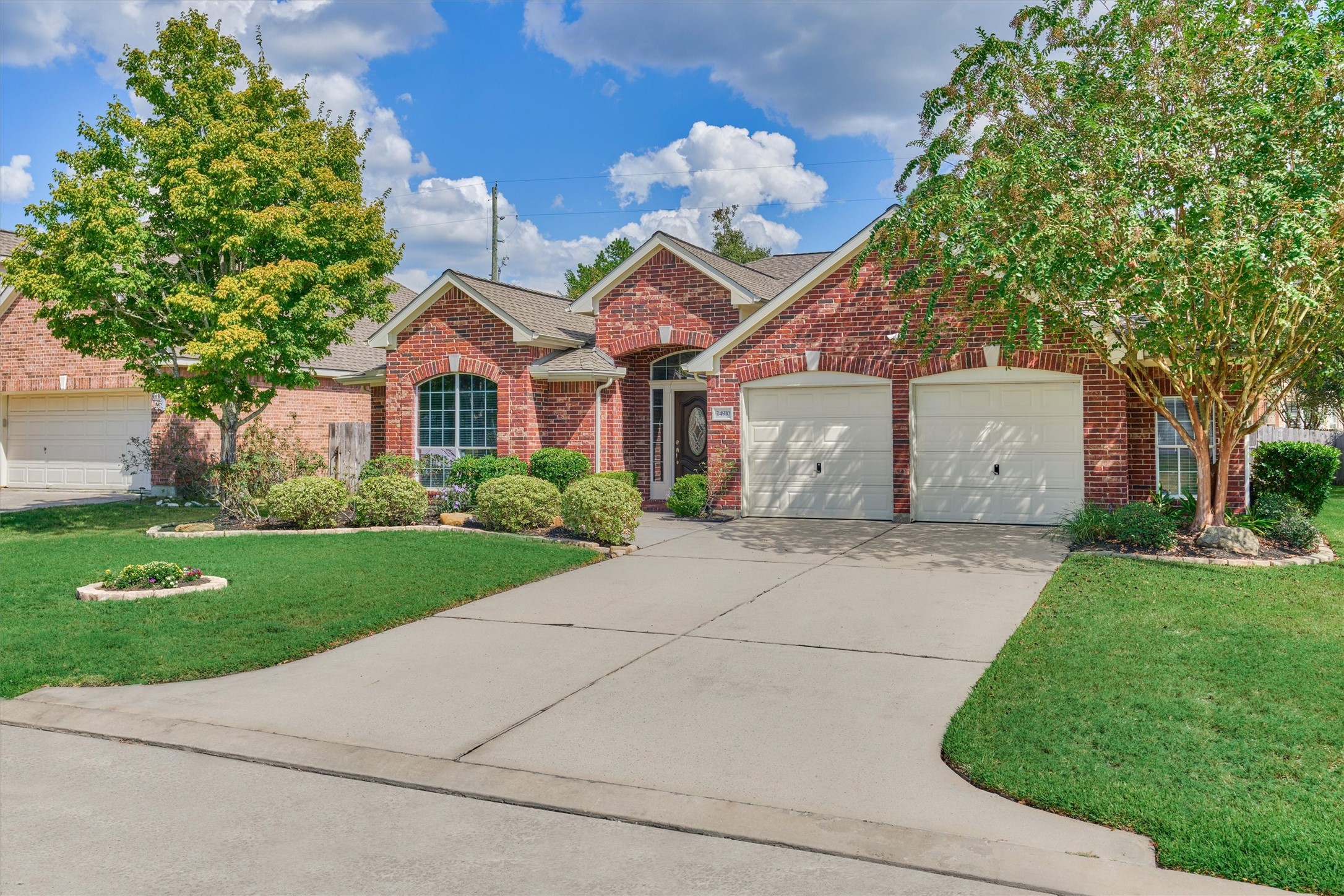 24910 Corbin Gate Drive Spring, TX 77389 - Photo 2 of 49 a front view of house with yard and green space