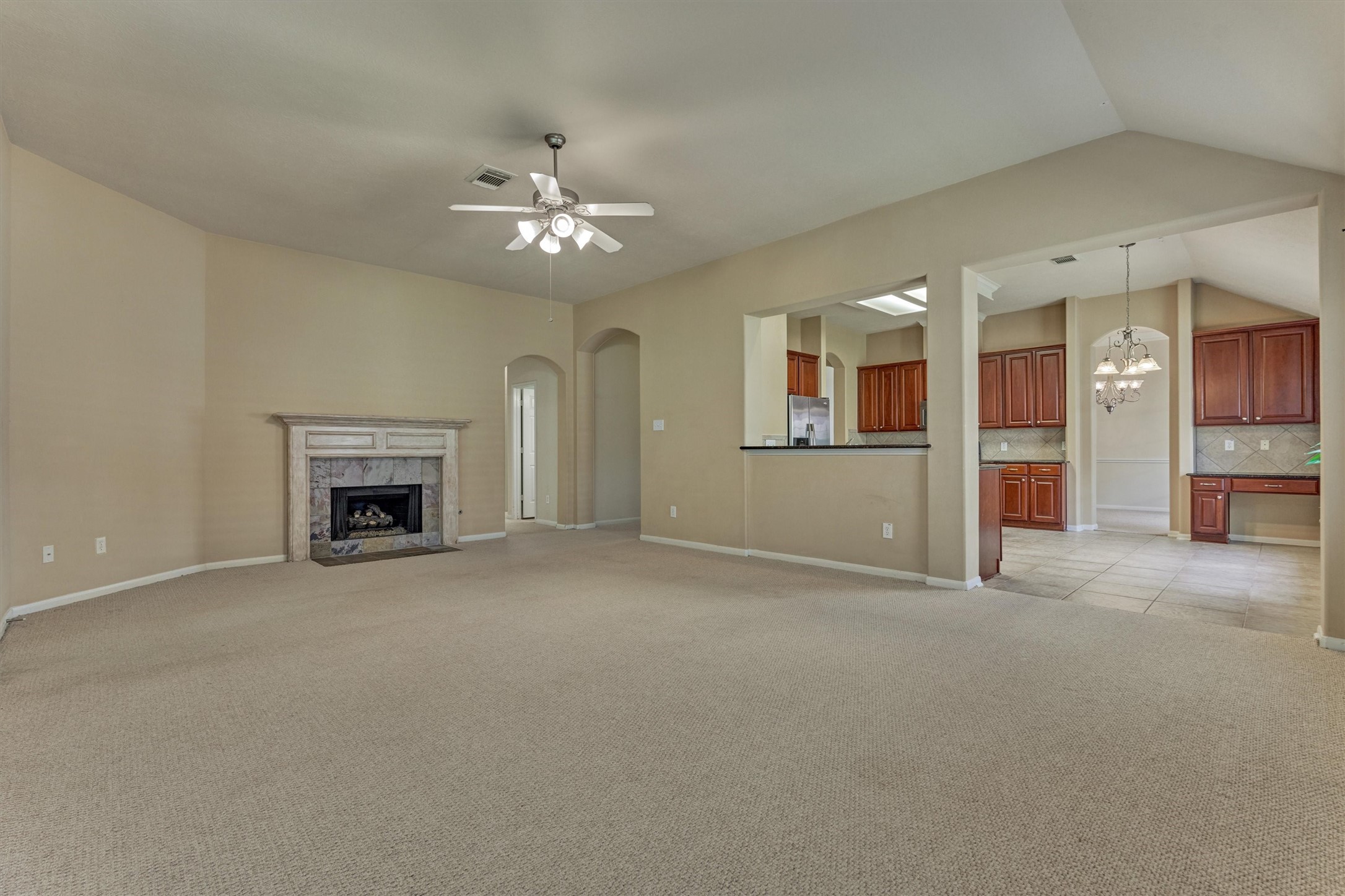 24910 Corbin Gate Drive Spring, TX 77389 - Photo 21 of 49 an empty room with windows and fireplace