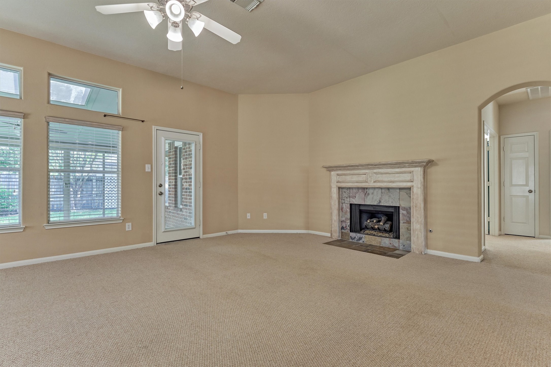 24910 Corbin Gate Drive Spring, TX 77389 - Photo 23 of 49 a view of an empty room with a fireplace