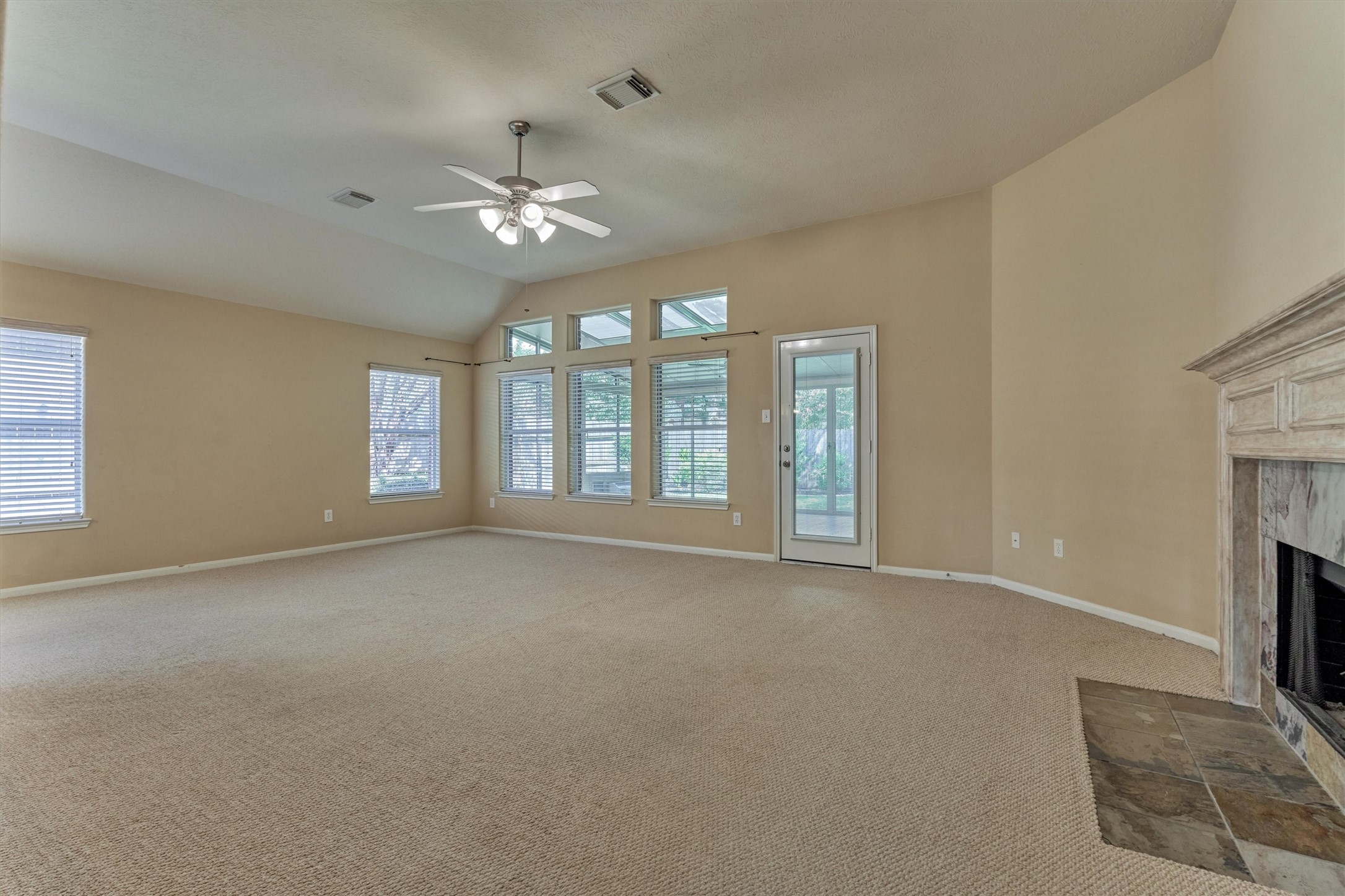 24910 Corbin Gate Drive Spring, TX 77389 - Photo 24 of 49 a view of an empty room with a fireplace