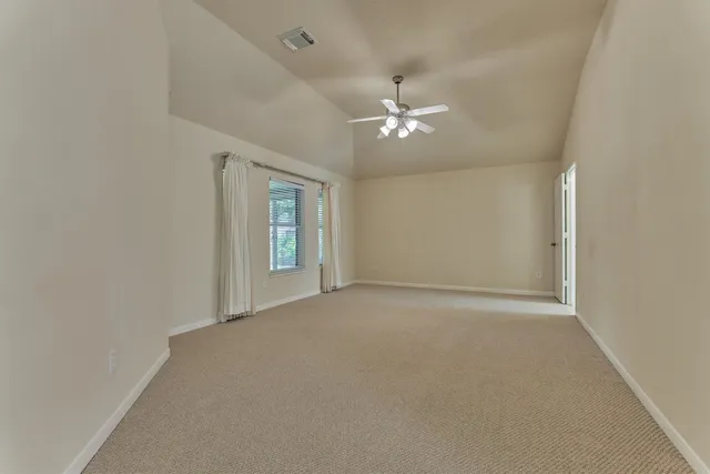 a view of empty room with fan