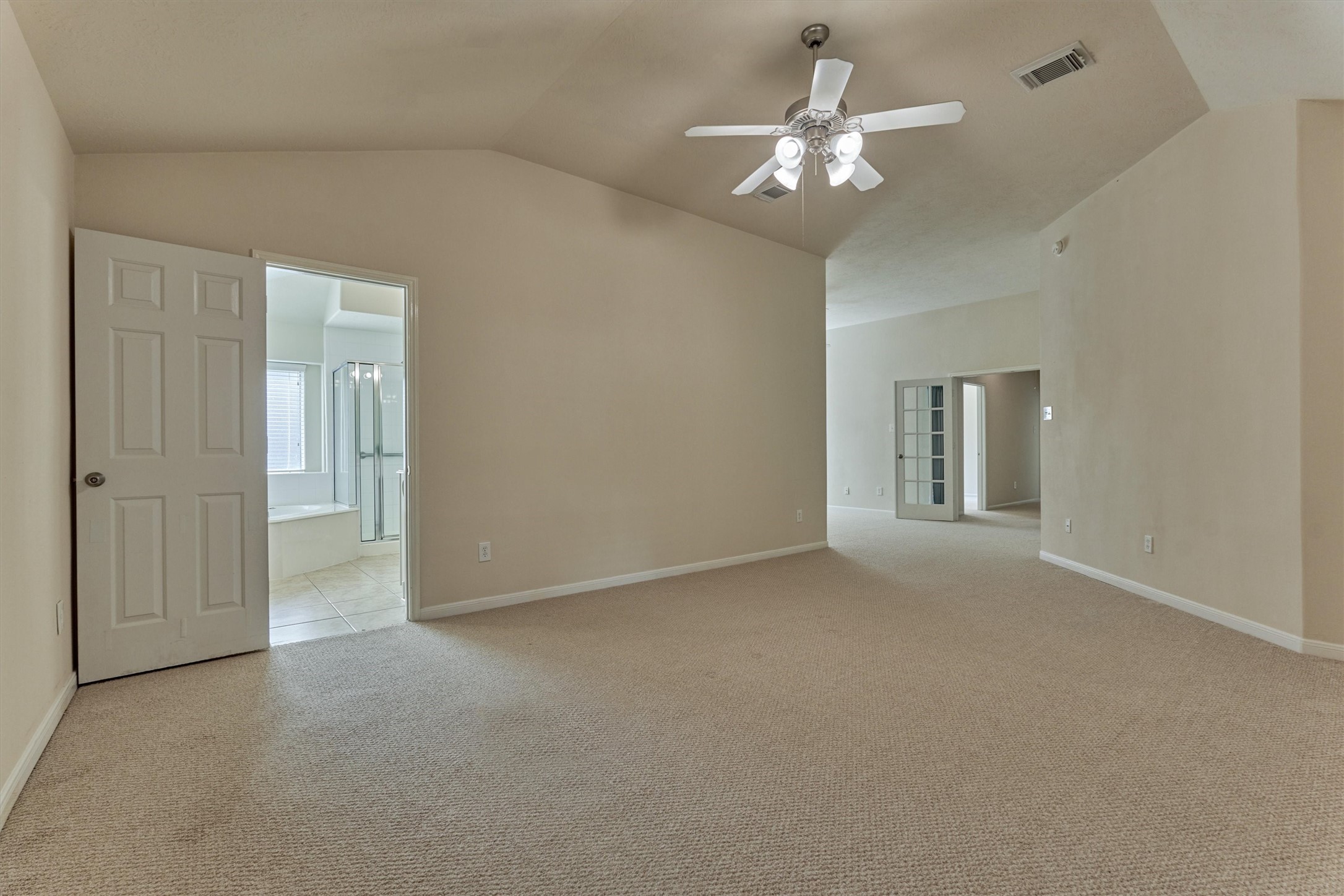 24910 Corbin Gate Drive Spring, TX 77389 - Photo 32 of 49 a view of a room with a ceiling fan and a chandelier fan
