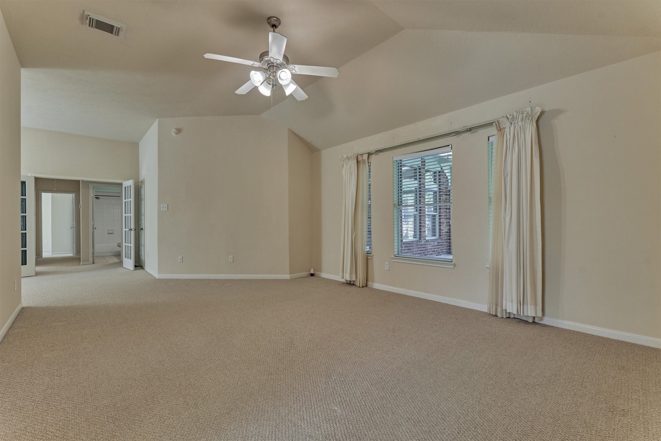 24910 Corbin Gate Drive Spring, TX 77389 - Photo 33 of 49 a view of an empty room with a chandelier fan