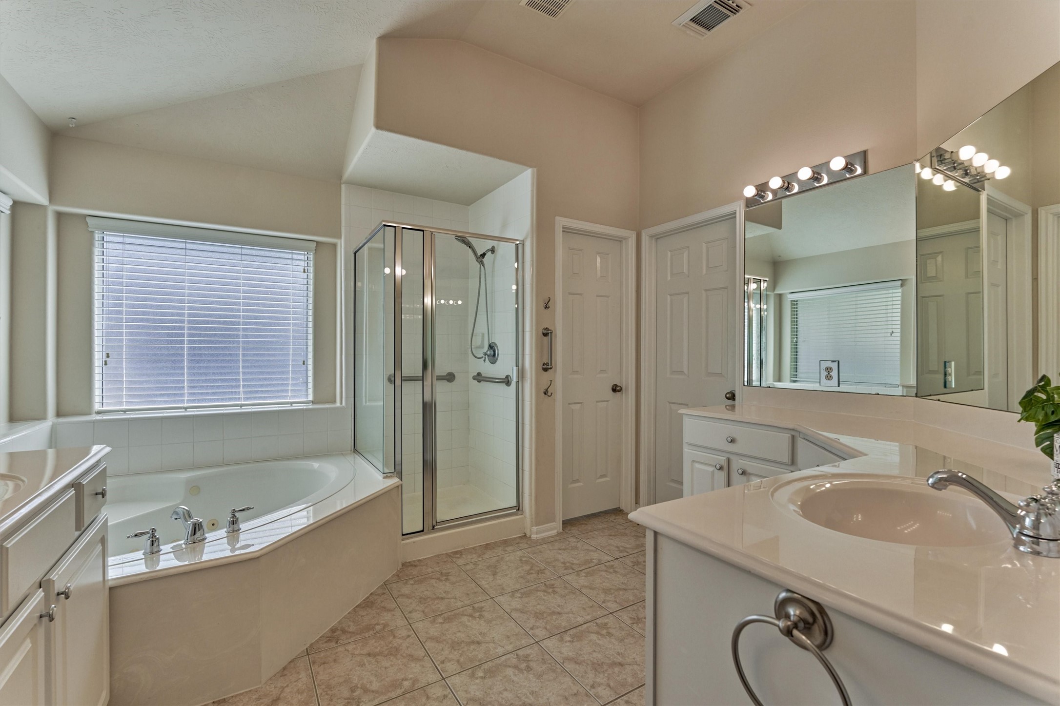 24910 Corbin Gate Drive Spring, TX 77389 - Photo 34 of 49 a bathroom with a granite countertop tub sink and mirror