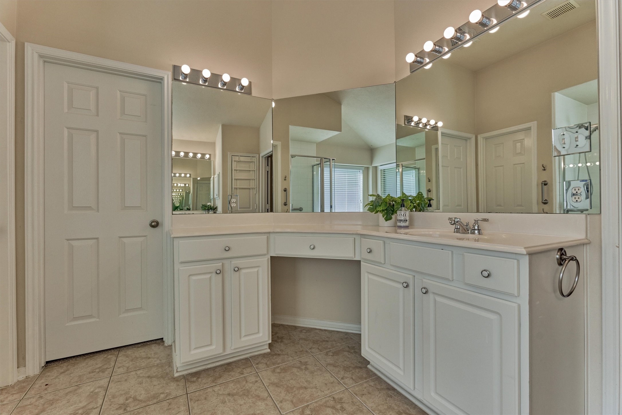 24910 Corbin Gate Drive Spring, TX 77389 - Photo 36 of 49 a bathroom with a double vanity sink and a mirror