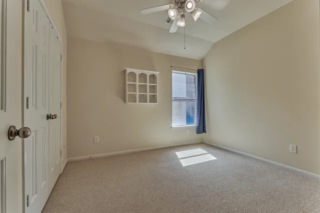 a view of empty room with windows