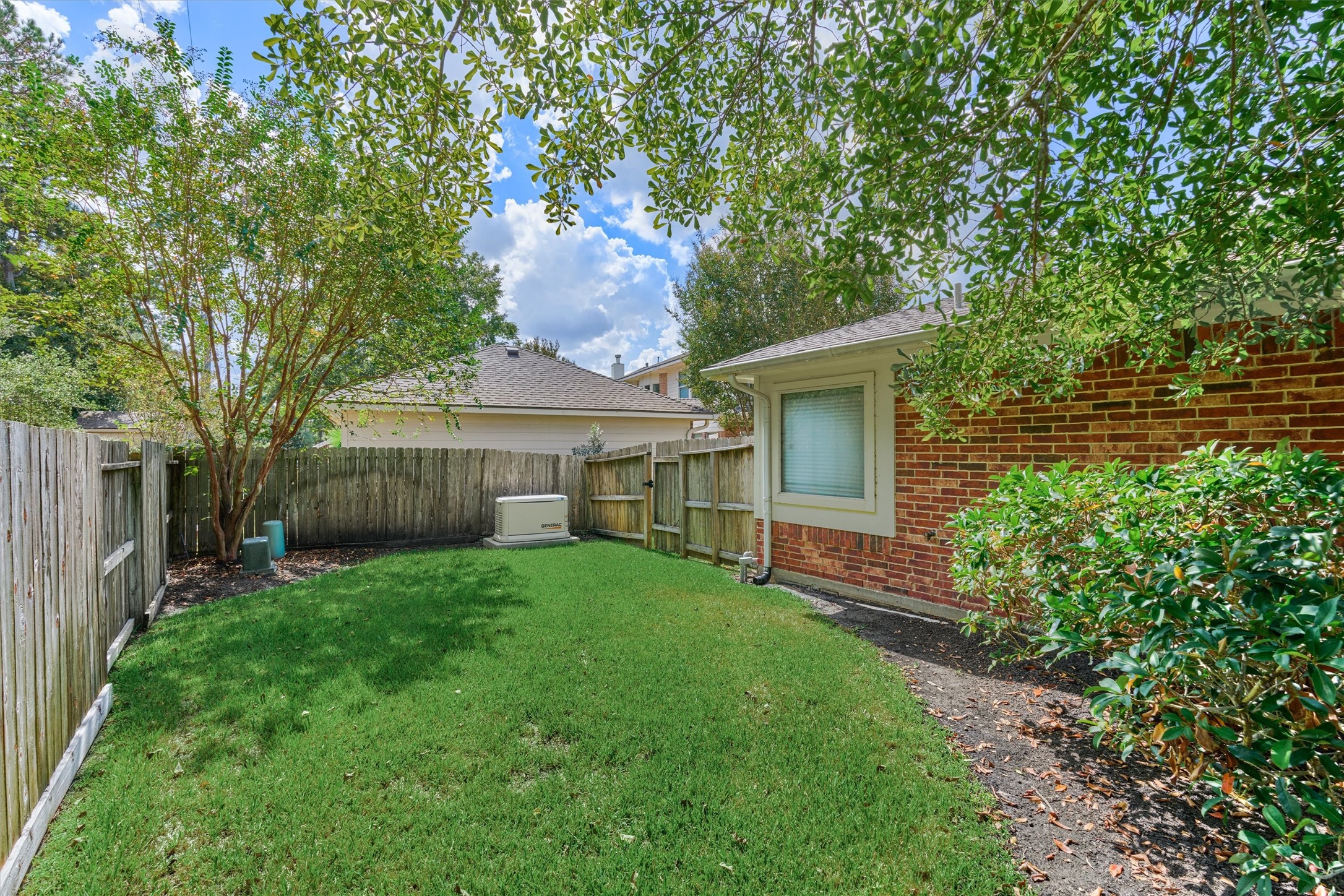 24910 Corbin Gate Drive Spring, TX 77389 - Photo 44 of 49 a front view of a house with a garden