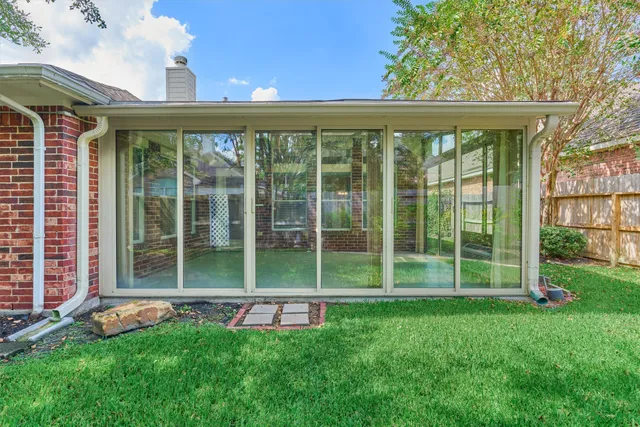 a view of a house with a backyard