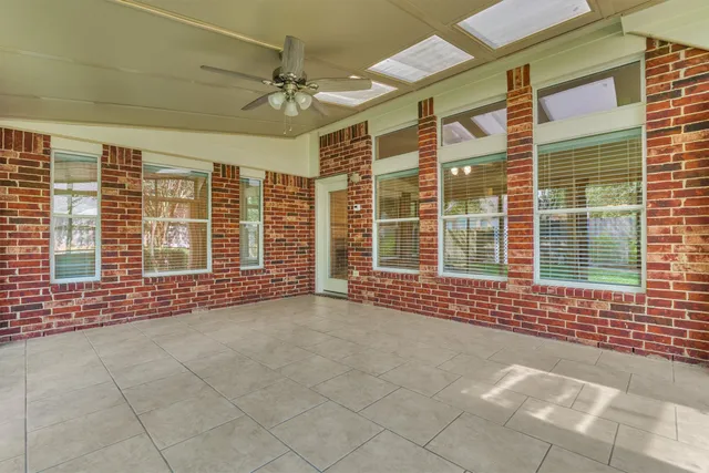 a view of an empty room with a balcony